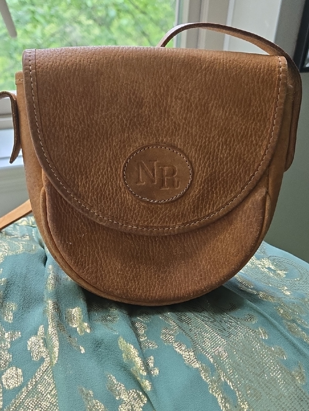 Nina Ricci vintage leather goods Embossed Saddle Crossbody Bag in Warm Brown